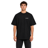 DAWIS Core black oversized cotton t-shirt with front logo print worn by a male model