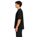 DAWIS Core oversize black cotton t-shirt worn by a man in profile view, featuring heavy 280g fabric.